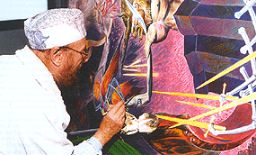 Ernst Fuchs bei der Arbeit an